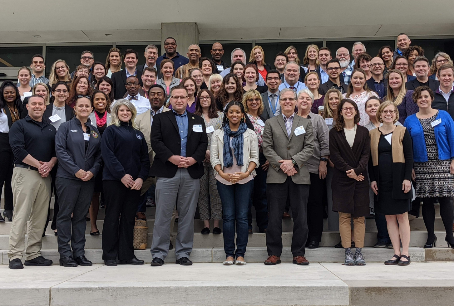 Several dozen attendees of the Diffusion of Excellence’s Base Camp and VHA’s Diffusion Academy stand and smile on the steps of the Southeast Louisiana Veterans Health Care System in New Orleans in February 2020.
