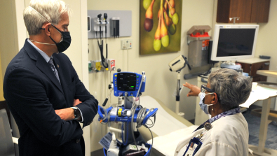 VA Secretary McDonough speaks with a clinician during his visit to the D.C. VA Medical Center in February 2021.